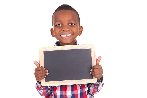 Adorable african little boy  with slate